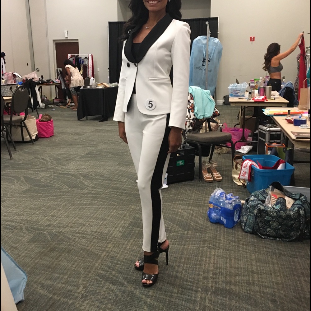 Sleek white tuxedo style interview or work suit.